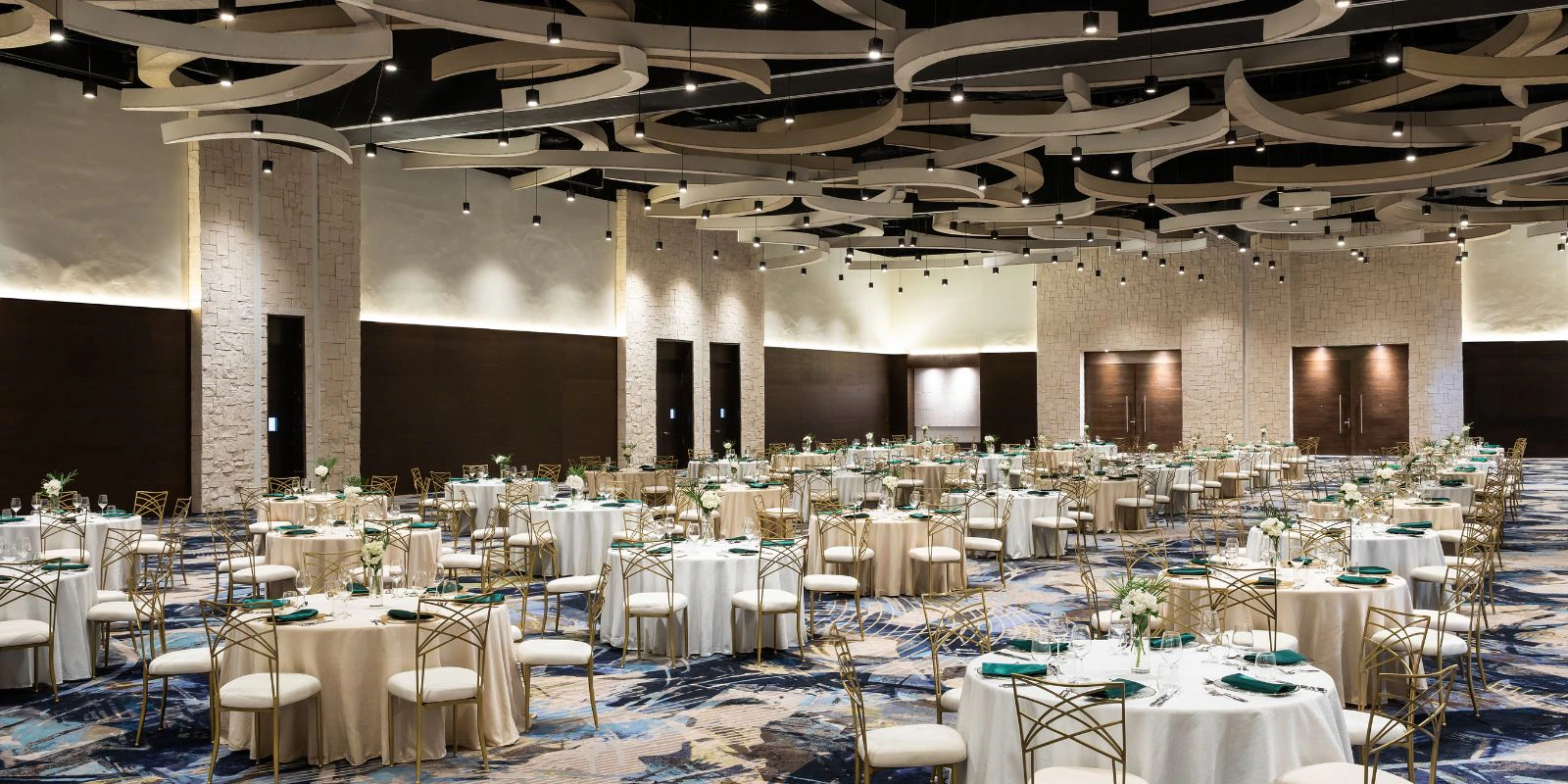 Elegant ballroom wedding banquet setup at Hyatt Ziva Cap Cana with chandeliers and formal reception decor