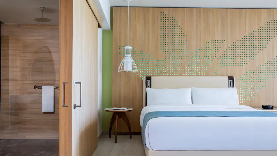 King bedroom with contemporary décor in the Club Ocean View One Bedroom Grand Master Suite at Hyatt Ziva Cap Cana.