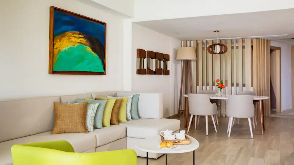 Separate living room with sleeper sofa in the Club Ocean View One Bedroom Grand Master Suite at Hyatt Ziva Cap Cana.