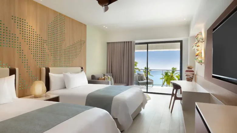 Club Oceanfront Junior Suite Double with two queen beds and oceanfront balcony at Hyatt Ziva Cap Cana.