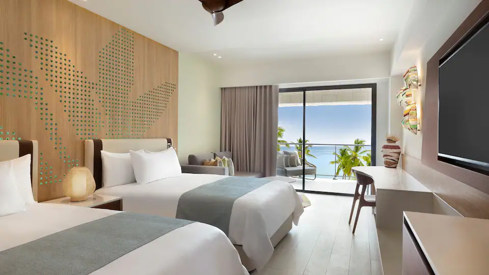 Club Oceanfront Junior Suite Double with two queen beds and oceanfront balcony at Hyatt Ziva Cap Cana.