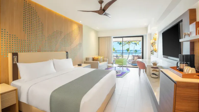 Club Oceanfront Junior Suite King with king bed, seating area, and oceanfront balcony at Hyatt Ziva Cap Cana.