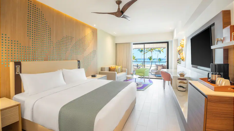 Club Oceanfront Junior Suite King with king bed, seating area, and oceanfront balcony at Hyatt Ziva Cap Cana.