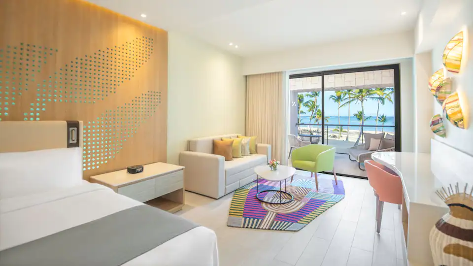 Club Oceanfront Junior Suite King living area with ocean-view balcony at Hyatt Ziva Cap Cana.