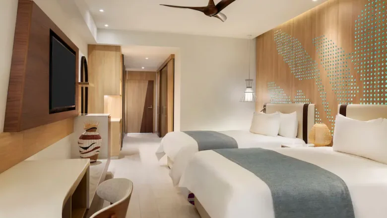 Club Oceanfront Junior Suite Swim-Up Double with two queen beds at Hyatt Ziva Cap Cana.