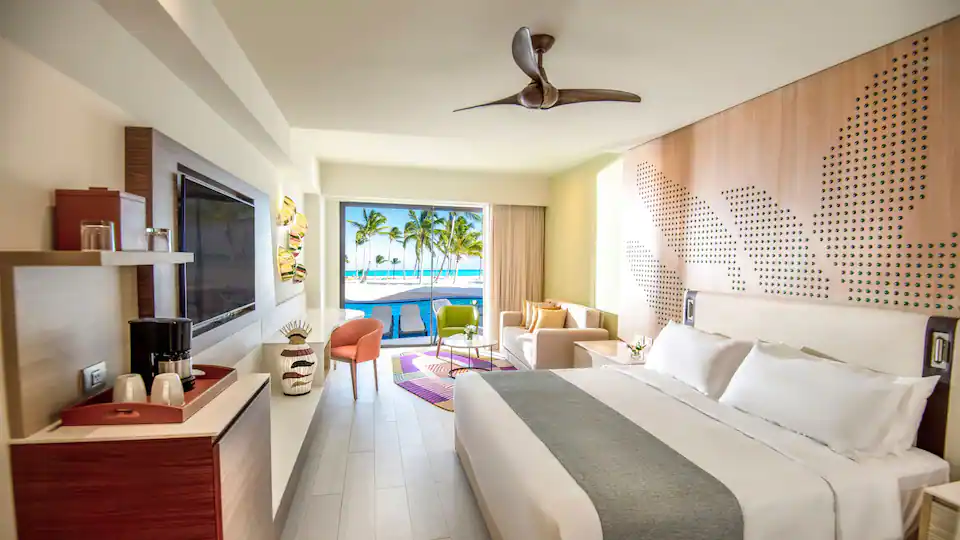 Club Oceanfront Junior Suite Swim-Up King living area with ocean views at Hyatt Ziva Cap Cana.