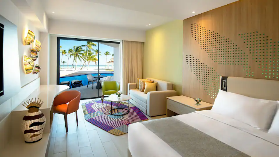 Club Oceanfront Junior Suite Swim-Up King with king bed and oceanfront terrace at Hyatt Ziva Cap Cana.