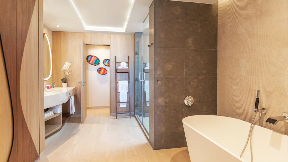 Luxury bathroom with freestanding soaking tub, walk-in shower, and vanity in the Club One Bedroom Master Suite at Hyatt Ziva Cap Cana.