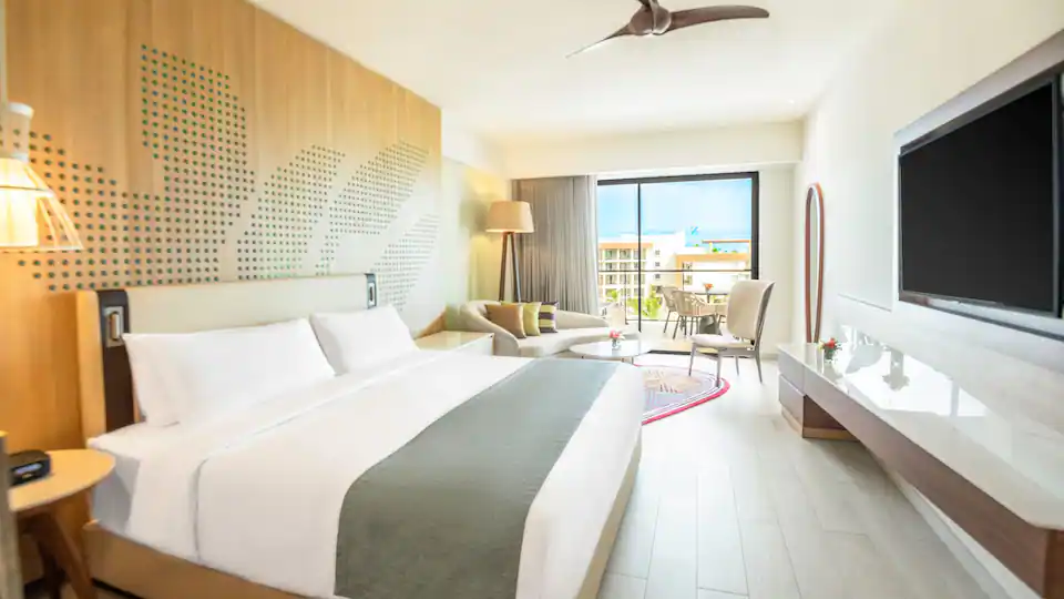 King bedroom with balcony access in the Club One Bedroom Master Suite at Hyatt Ziva Cap Cana.