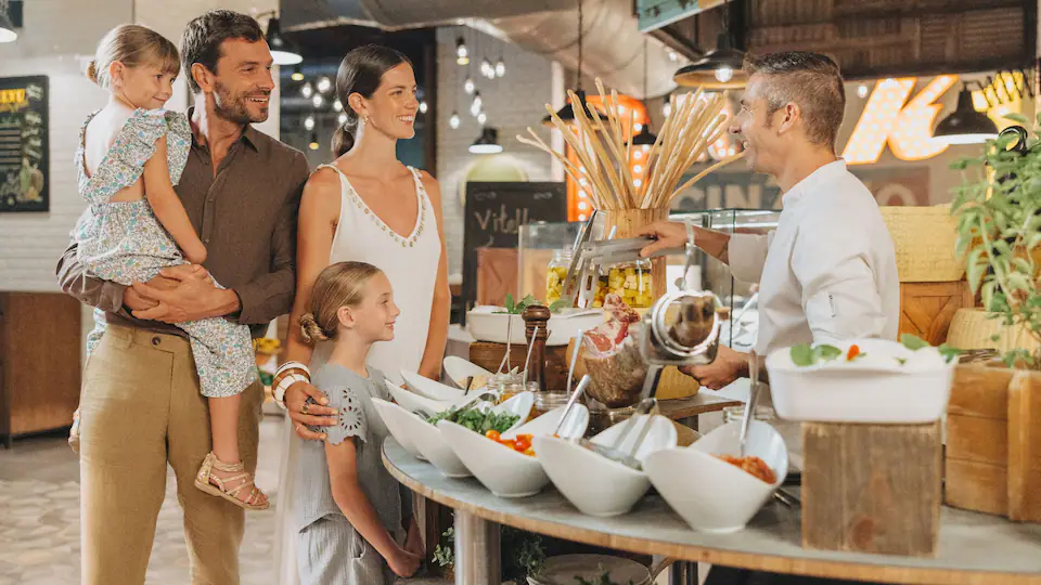 El Mercado buffet restaurant at Hyatt Ziva Cap Cana featuring international cuisine stations, contemporary dining spaces, and a vibrant market-style atmosphere.