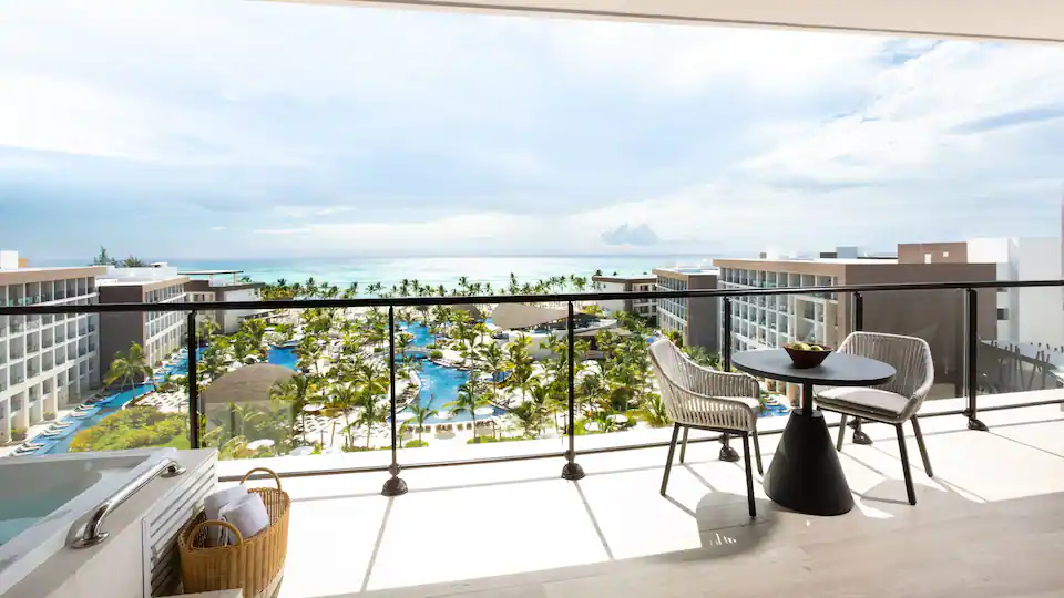 Private balcony with outdoor seating, hot tub, and panoramic ocean views from the Presidential Suite at Hyatt Ziva Cap Cana.