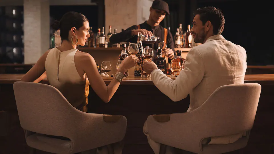 Twisted Timbers lobby lounge at Hyatt Ziva Cap Cana featuring a distinctive sculptural wooden bar, stylish seating, and a welcoming social atmosphere.